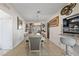 Dining room featuring a contemporary table and chairs, modern lighting, and access to an adjacent kitchen area at 1916 Canosa Ave, Las Vegas, NV 89104