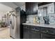 Kitchen featuring stainless steel appliances, granite countertops and dark cabinetry at 1916 Canosa Ave, Las Vegas, NV 89104