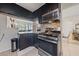 Kitchen featuring modern stainless steel appliances, dark cabinetry and modern tile backsplash at 1916 Canosa Ave, Las Vegas, NV 89104