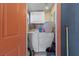 Functional laundry room equipped with a washer, dryer, and storage cabinets for efficient organization at 1916 Canosa Ave, Las Vegas, NV 89104