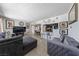 Comfortable living room featuring tile flooring, neutral walls adorned with art, and stylish decor at 1916 Canosa Ave, Las Vegas, NV 89104
