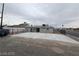 A spacious fenced backyard featuring concrete flooring and a view of the back of the house at 2036 Canosa Ave, Las Vegas, NV 89104