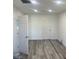 This bedroom offers neutral walls, recessed lights, stylish floors, and two entry doors at 2036 Canosa Ave, Las Vegas, NV 89104