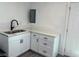 Bright kitchen features stainless steel sink, modern faucet, white countertops, and ample cabinet space at 2036 Canosa Ave, Las Vegas, NV 89104