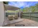 Cozy outdoor patio area with stylish furniture and a fenced-in yard for privacy at 207 E Van Wagenen St, Henderson, NV 89015