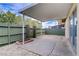 Enclosed backyard with covered patio, decorative landscaping and view of the yard at 207 E Van Wagenen St, Henderson, NV 89015