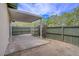 Enclosed backyard with covered patio, green fence, and low maintenance landscaping at 207 E Van Wagenen St, Henderson, NV 89015