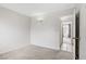 Spacious bedroom featuring neutral carpet, a ceiling light and doorway view at 207 E Van Wagenen St, Henderson, NV 89015