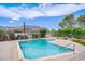 Community pool with flowering bushes and mountain views at 207 E Van Wagenen St, Henderson, NV 89015
