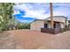 Charming home exterior with desert landscaping offering curb appeal at 207 E Van Wagenen St, Henderson, NV 89015