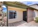 Tan single story house with brown brick accent and low maintenance yard at 207 E Van Wagenen St, Henderson, NV 89015