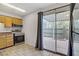 Bright eat-in kitchen with oak cabinetry and stainless steel appliances at 207 E Van Wagenen St, Henderson, NV 89015