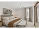 Serene primary bedroom with a plush king-size bed, soft lighting, and mirrored closet at 207 E Van Wagenen St, Henderson, NV 89015