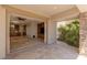 Spacious back patio featuring seamless indoor-outdoor living with open access to the interior at 2436 Grassy Spring Pl, Las Vegas, NV 89135