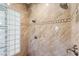 Luxurious bathroom featuring dual shower heads and decorative tile accents at 2436 Grassy Spring Pl, Las Vegas, NV 89135