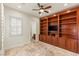 Bonus room with custom built-ins and a ceiling fan at 2436 Grassy Spring Pl, Las Vegas, NV 89135