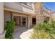 Charming outdoor area with an open door to the interior with desert landscaping at 2436 Grassy Spring Pl, Las Vegas, NV 89135