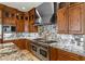 Chef's kitchen boasts custom cabinetry, granite counters and high end stainless steel appliances at 2436 Grassy Spring Pl, Las Vegas, NV 89135