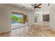 Living room with custom built-ins and sliding glass doors opening to the swimming pool at 2436 Grassy Spring Pl, Las Vegas, NV 89135