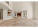 Spacious living area with travertine floors, open floor plan, and abundant natural light at 2436 Grassy Spring Pl, Las Vegas, NV 89135