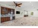 Spacious entertainment area with a wet bar, beverage fridge, projector screen, and recessed lighting at 2436 Grassy Spring Pl, Las Vegas, NV 89135