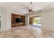 Living room has custom built-in cabinets and sliding glass doors leading to pool at 2436 Grassy Spring Pl, Las Vegas, NV 89135