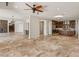 Open floor plan shows living room, wet bar and kitchen all with matching stone floors at 2436 Grassy Spring Pl, Las Vegas, NV 89135