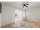 Bright, travertine tiled bonus room with recessed lighting, ceiling fan, and doorway to adjacent space at 2436 Grassy Spring Pl, Las Vegas, NV 89135