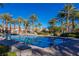 Outdoor swimming pool with lane markers for exercise and community lounging area at 2436 Grassy Spring Pl, Las Vegas, NV 89135