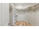 Spacious walk-in closet with custom shelving and tile flooring at 2436 Grassy Spring Pl, Las Vegas, NV 89135