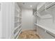 Well-organized walk-in closet with built-in shelves and ample storage space at 2436 Grassy Spring Pl, Las Vegas, NV 89135