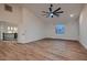 Bright and spacious bedroom features hardwood floors, a ceiling fan, and an open doorway at 2448 Ram Crossing Way, Henderson, NV 89074
