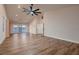 Large bedroom with hardwood floors, high ceiling, fan, and access to private patio through sliding glass doors at 2448 Ram Crossing Way, Henderson, NV 89074