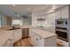 Modern kitchen featuring white cabinets, stainless appliances, and center island at 2448 Ram Crossing Way, Henderson, NV 89074
