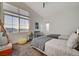 Bedroom featuring two twin beds, a window with a view, and neutral decor at 2669 Via Monet, Henderson, NV 89044
