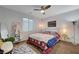 Bedroom featuring a ceiling fan and neutral decor with a large area rug at 2669 Via Monet, Henderson, NV 89044