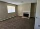 Bedroom featuring carpet floors, fireplace, and natural light at 2773 Heritage Ct, Las Vegas, NV 89121