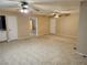 Open-concept living room with tiled floors and dual ceiling fans at 2773 Heritage Ct, Las Vegas, NV 89121