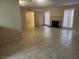 Spacious living room featuring tile flooring, a brick fireplace, and an open layout at 2773 Heritage Ct, Las Vegas, NV 89121
