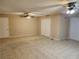 Living area showcasing tile floors, dual ceiling fans and multiple closets at 2773 Heritage Ct, Las Vegas, NV 89121