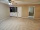 Living room featuring a wet bar, tile floor, and entrance to the kitchen at 2773 Heritage Ct, Las Vegas, NV 89121