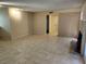 Bright, open living space with tile flooring, flowing into the kitchen and hallways at 2773 Heritage Ct, Las Vegas, NV 89121