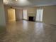 Inviting living room featuring tile flooring, a brick fireplace, and seamless flow into other living spaces at 2773 Heritage Ct, Las Vegas, NV 89121