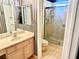 Cozy bathroom featuring a single sink vanity, toilet and shower with glass enclosure at 2820 Bluff Point Dr, Las Vegas, NV 89134