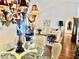 Elegant dining room featuring a glass table, chandelier, and views into the living room at 2820 Bluff Point Dr, Las Vegas, NV 89134