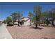 Charming single-story home featuring desert landscaping and mature trees, offering curb appeal at 2820 Bluff Point Dr, Las Vegas, NV 89134