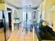 Eat in kitchen featuring stainless steel appliances, a dining table, and white cabinets at 2820 Bluff Point Dr, Las Vegas, NV 89134