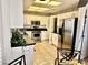 Eat in kitchen featuring stainless steel appliances, a dining table, and white cabinets at 2820 Bluff Point Dr, Las Vegas, NV 89134