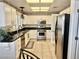 Well-lit kitchen with white cabinets, dark countertops and stainless steel appliances at 2820 Bluff Point Dr, Las Vegas, NV 89134