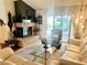 Inviting living room with fireplace, and comfortable seating in a well lit room at 2820 Bluff Point Dr, Las Vegas, NV 89134